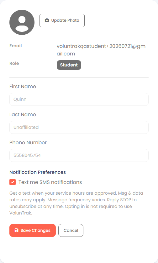 VolunTrak My Profile page showing the Phone Number field and, below it, a checked 'Text me SMS notifications' checkbox under a Notification Preferences heading, with helper text about message rates, frequency, and opting out